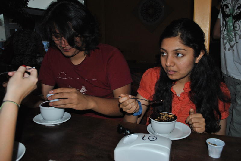 Kristopher (left) and Sheela eat a for jantar (dinner) a bowl of açai